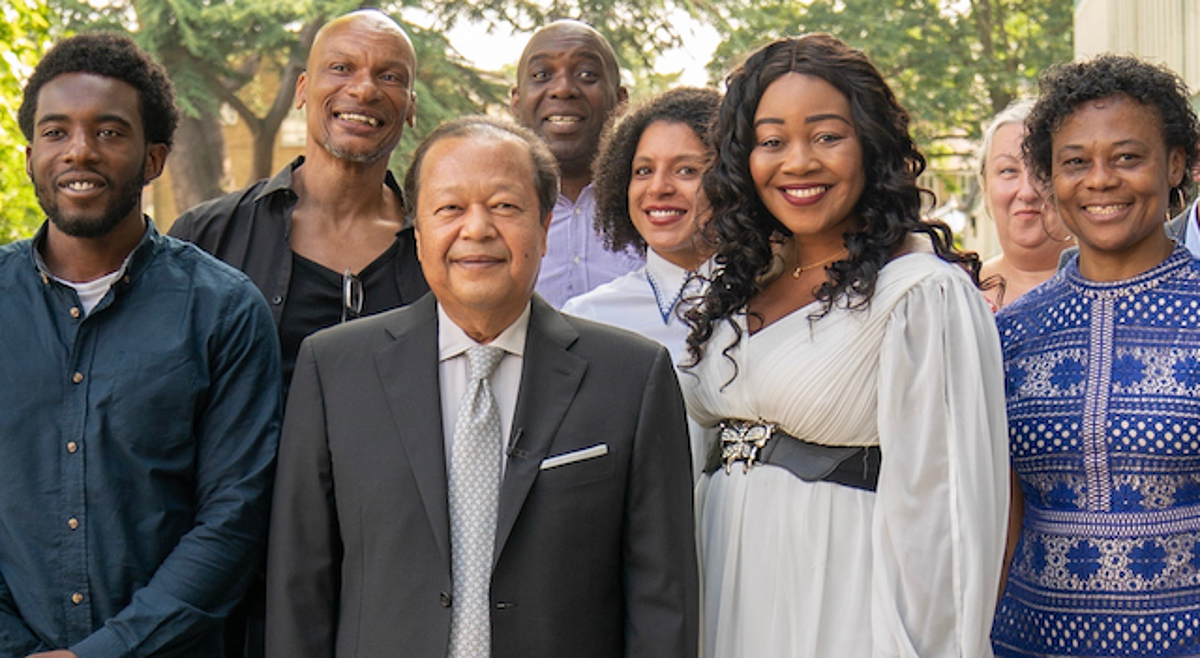 Prem Rawat with several people featured in the film